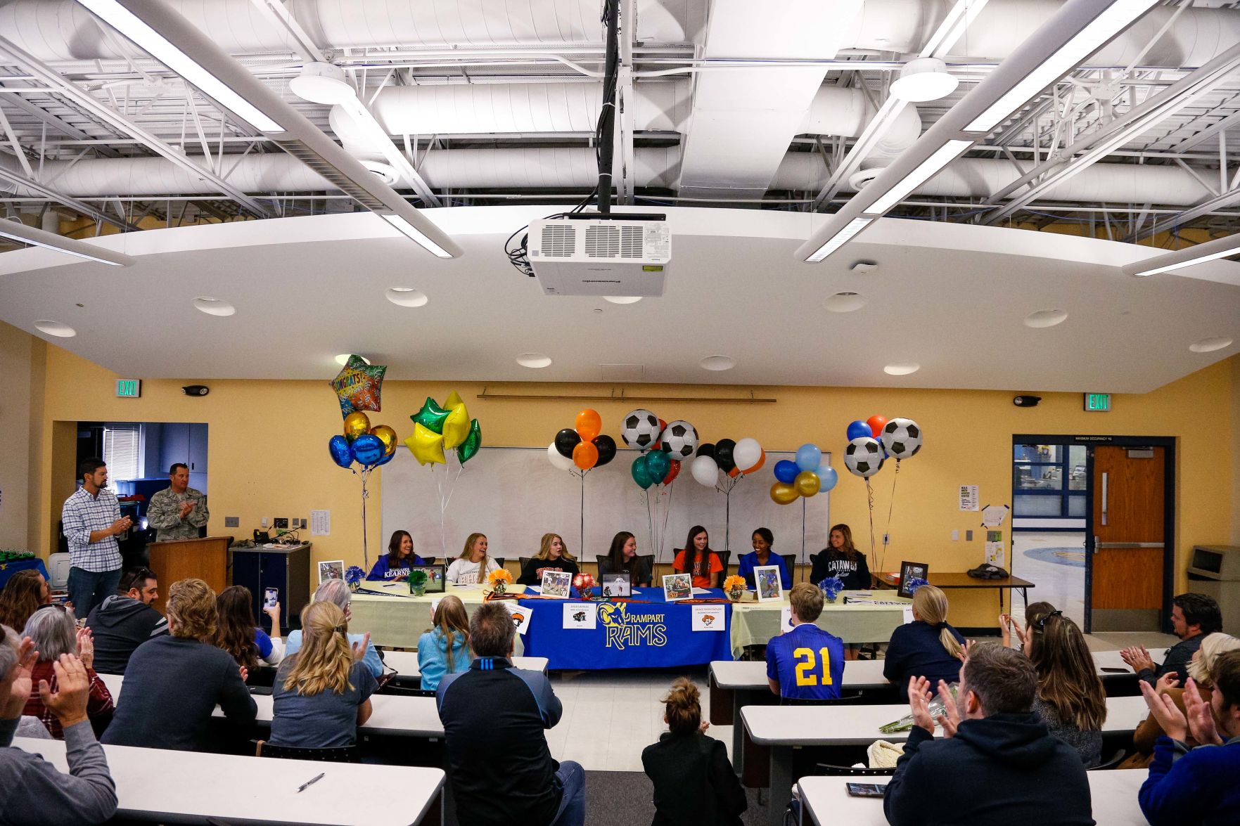 SIGNING DAY: Rampart athletes sign their National Letter of Intent